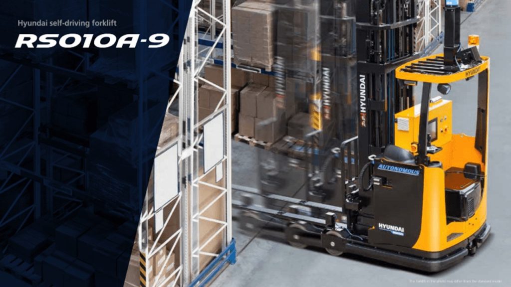 Hyundai RS010A-9 autonomous self-driving forklift operating in a warehouse aisle next to high-bay shelving