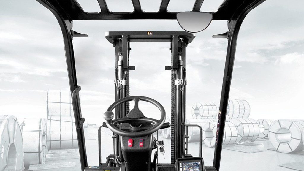 Forklift operator's forward view through the mast in a steel coil storage yard