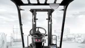 Forklift operator's forward view through the mast in a steel coil storage yard